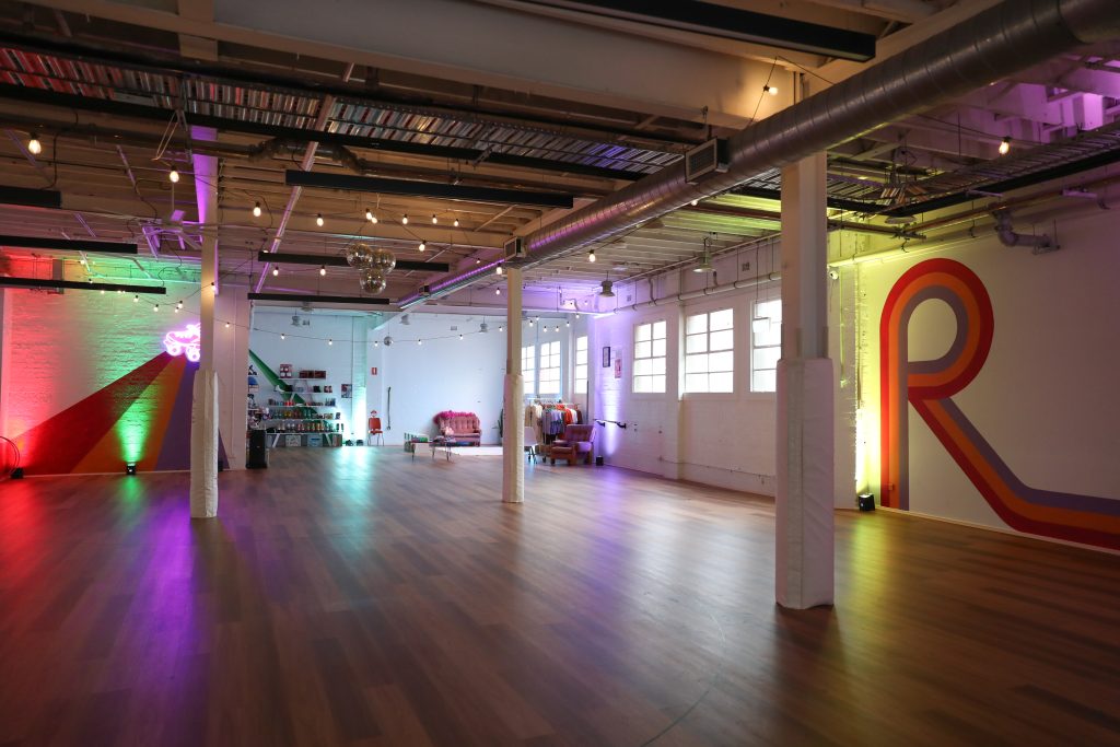 RollerMart, private studio and venue hire space in Sydney, lit up with disco lights.
